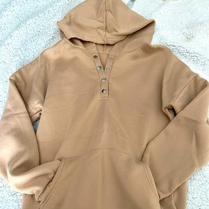 Size M tan coloured hoodie.